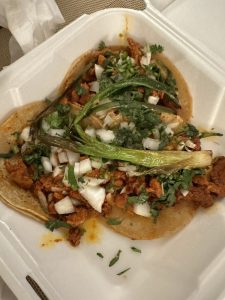 Adobada Taco with marinated pork, onions, and cilantro at La Lomita Mexican Grill. Feel free to modify any details as needed!