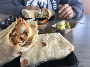 Big Cali Burrito with carne asada, guacamole, rice, and beans at La Lomita Mexican Grill. Feel free to modify any details as needed!