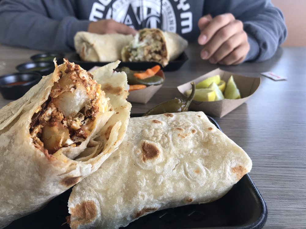 Big Cali Burrito with carne asada, guacamole, rice, and beans at La Lomita Mexican Grill. Feel free to modify any details as needed!