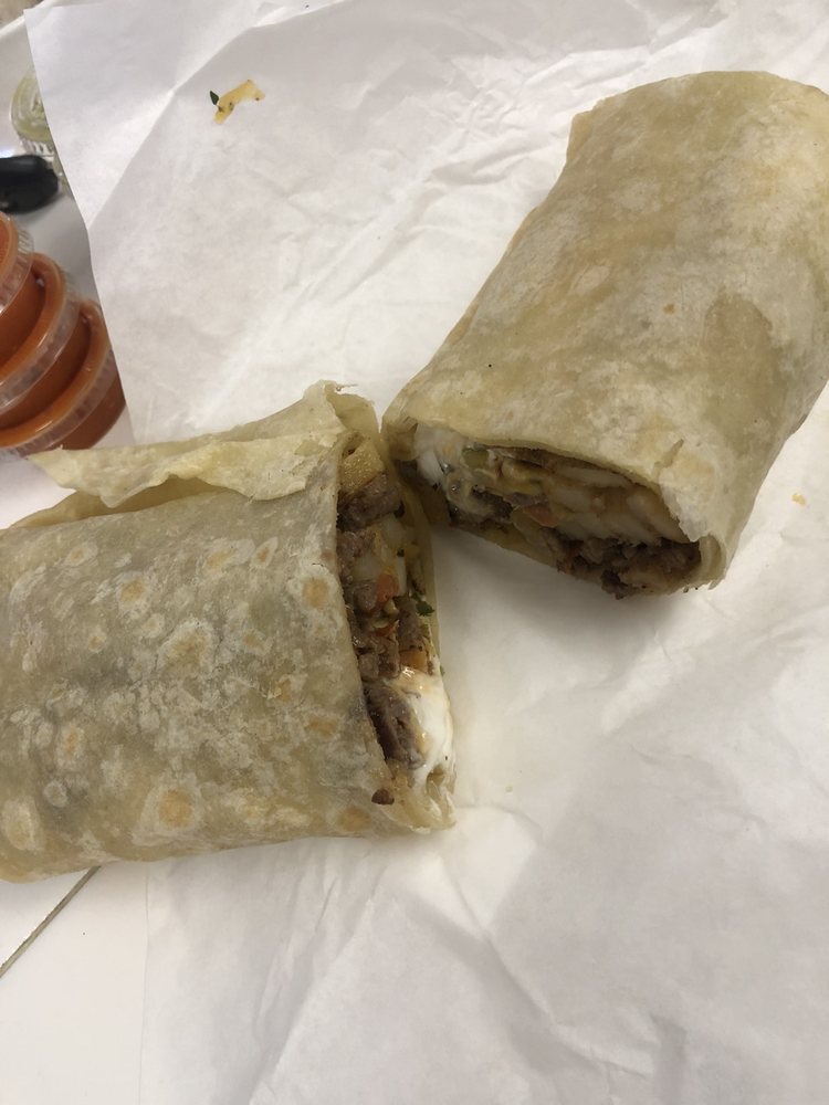 California Burrito with grilled steak, French fries, and cheese at La Lomita Mexican Grill. Feel free to modify any details as needed!