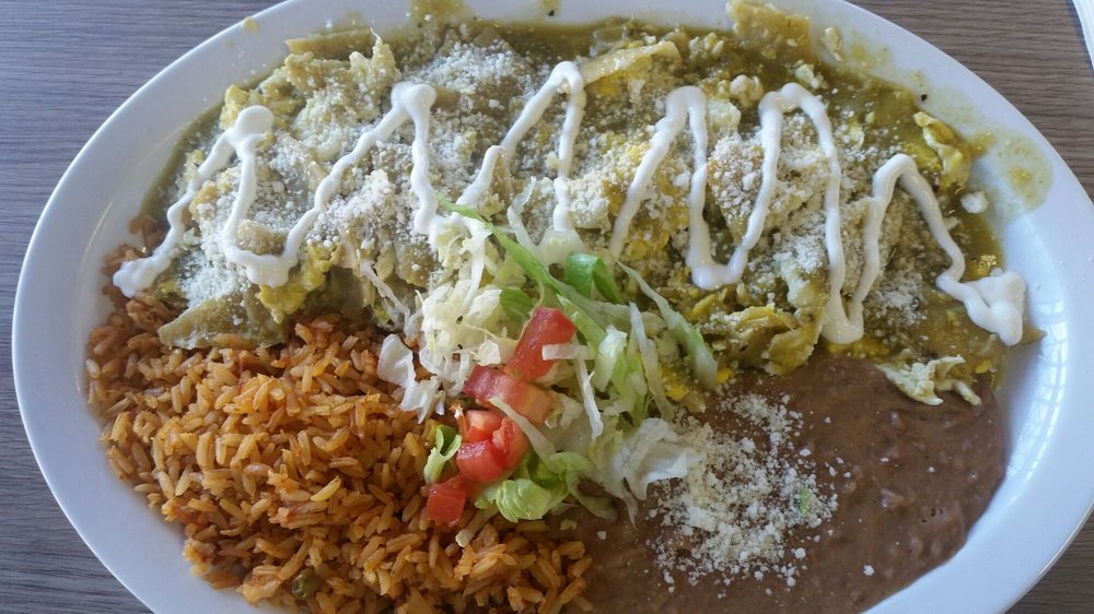 Chilaquiles Plate with tortilla chips, salsa, cheese, and a sunny-side-up egg at La Lomita Mexican Grill.