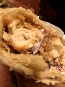 Fish Burrito with grilled white fish, rice, and lime crema at La Lomita Mexican Grill. Feel free to modify any details as needed!