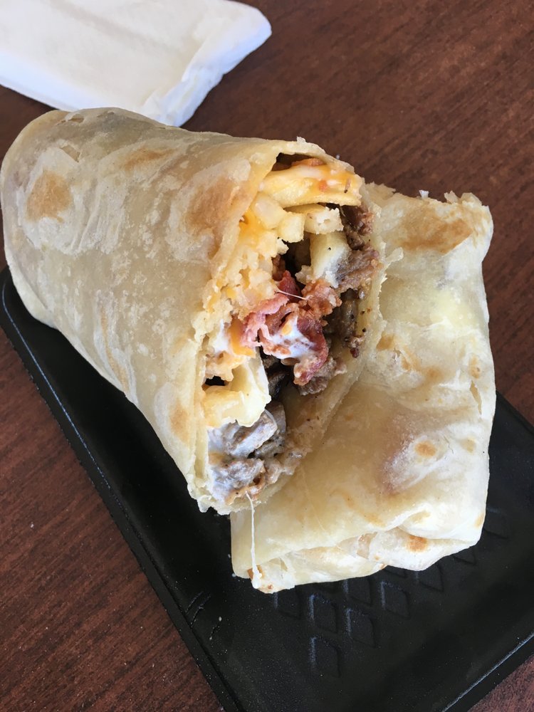 Harbison Burrito with shredded beef, beans, rice, and guacamole at La Lomita Mexican Grill. Feel free to modify any details as needed!