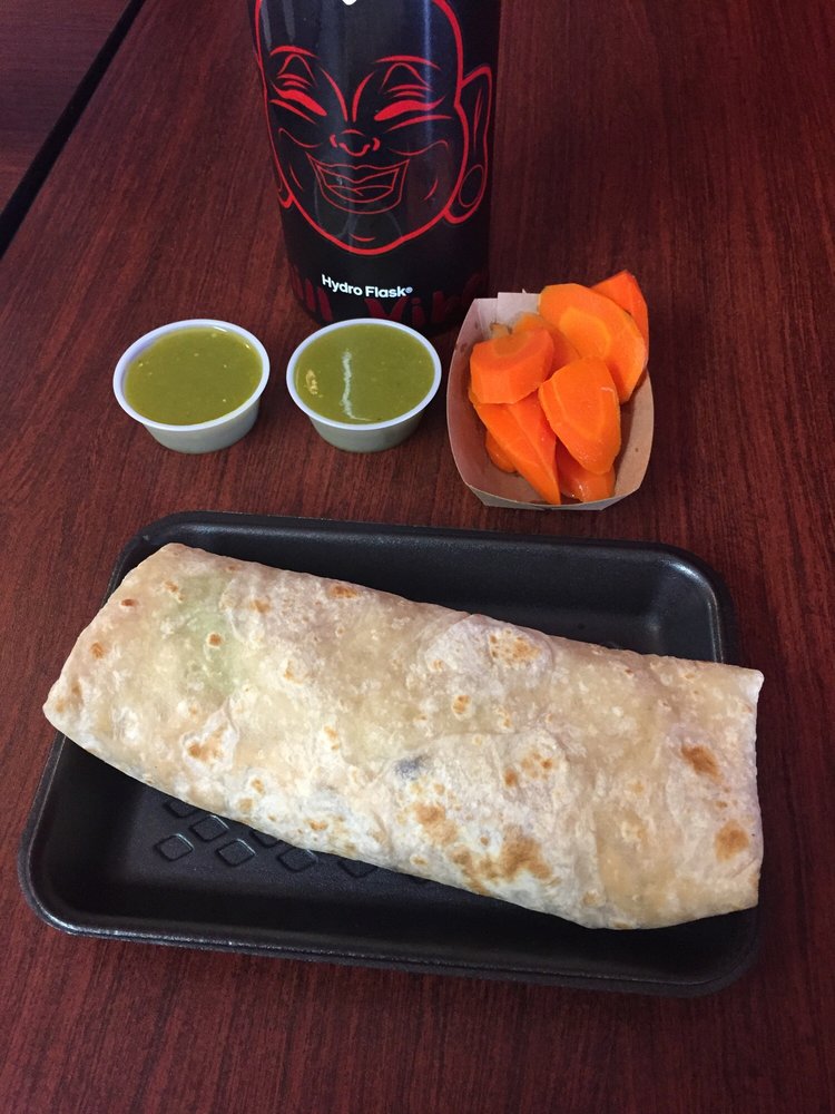Plaza Burrito with grilled chicken, black beans, rice, and salsa at La Lomita Mexican Grill. Feel free to modify any details as needed!
