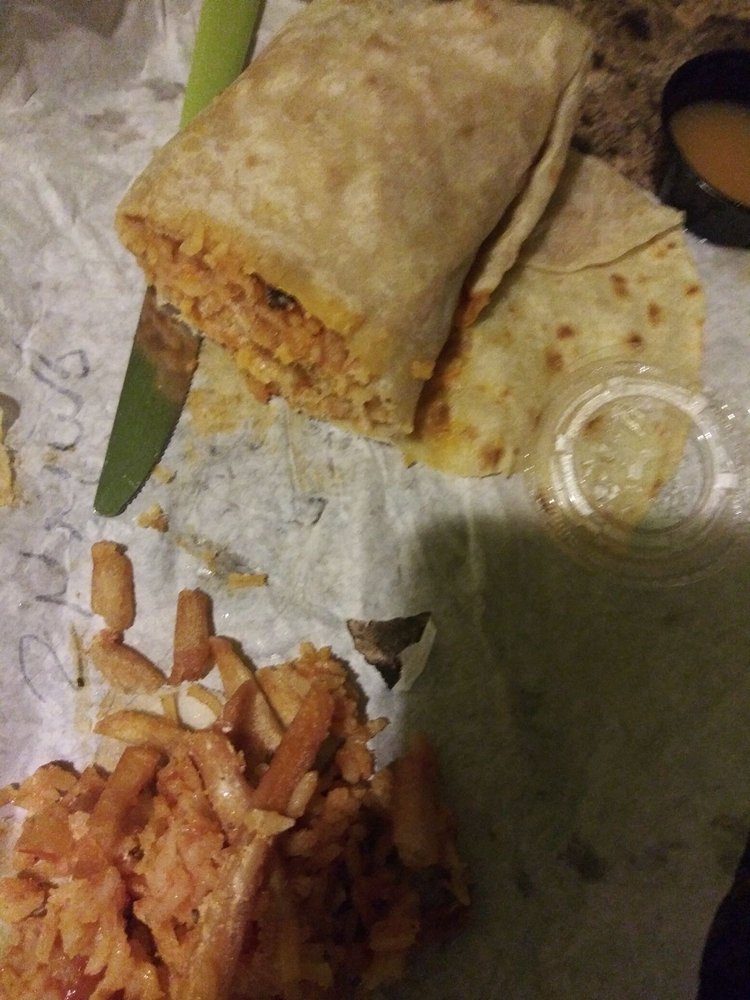 Shrimp Burrito with grilled shrimp, rice, and chipotle sauce at La Lomita Mexican Grill. Feel free to modify any details as needed!