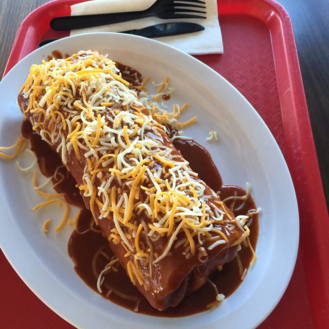Veggie Burrito with grilled vegetables, black beans, and avocado sauce at La Lomita Mexican Grill. Feel free to modify any details as needed!